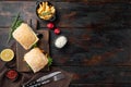 Fresh made Snack Sandwich with Fish Sticks, on wooden cutting board, on old dark  wooden table background, top view flat lay , Royalty Free Stock Photo