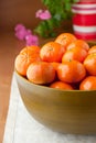 Fresh mandarin oranges in big wooden bowl Royalty Free Stock Photo