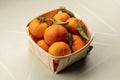 Fresh mandarin oranges fruit or tangerines with leaves in the wooden box. Ripe tangerines in a wooden basket. Healthy food concept Royalty Free Stock Photo