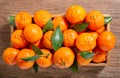 Fresh mandarin oranges fruit or tangerines with leaves in a wooden box Royalty Free Stock Photo