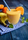 Fresh mandarin smoothie with banana and yoghurt