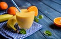 Fresh mandarin smoothie with banana and yoghurt