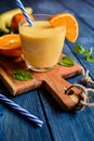 Fresh mandarin smoothie with banana and yoghurt