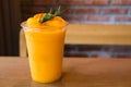 Fresh mandarin smoothie in glass