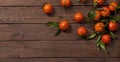 Fresh mandarines on old wooden table