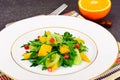 Fresh mango, arugula, kiwi, orange and pomegranate. Royalty Free Stock Photo
