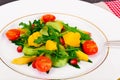Fresh mango, arugula, kiwi, orange and pomegranate. Royalty Free Stock Photo