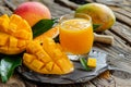 Fresh mango juice sliced ripe fruit, rustic table. Healthy eating lifestyle, vitamins, vegan Royalty Free Stock Photo