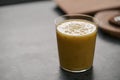 Fresh mango lulo smoothie on kitchen countertop Royalty Free Stock Photo