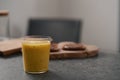 Fresh mango lulo smoothie on kitchen countertop Royalty Free Stock Photo