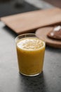 Fresh mango lulo smoothie on kitchen countertop Royalty Free Stock Photo