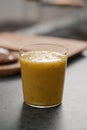 Fresh mango lulo smoothie on kitchen countertop Royalty Free Stock Photo