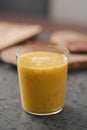 Fresh mango lulo smoothie on kitchen countertop Royalty Free Stock Photo