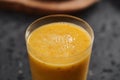 Fresh mango lulo smoothie on kitchen countertop Royalty Free Stock Photo