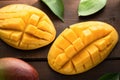 Fresh mango open on wooden background Royalty Free Stock Photo