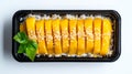 Fresh Mango Slices with Sesame on Sticky Rice in Black Container Royalty Free Stock Photo
