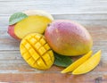 Fresh Mangoes On A Rustic Background