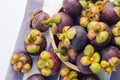 Fresh mangosteen fruits in the basket on paper background