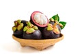 Fresh Mangosteen with leaves on bamboo basket isolated on white background Royalty Free Stock Photo