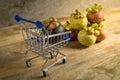 Fresh Mangosteen with shopping cart from Rayong Thailand on wood