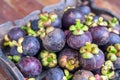 fresh mangosteen of Thailand, Thai fruit on wood plate Royalty Free Stock Photo