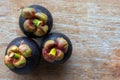 Fresh mangosteens on wood background