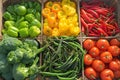 Fresh market produce tomatoes, lemon, lime, peppers in basket Royalty Free Stock Photo