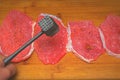 Fresh meat hammered on a wooden board Royalty Free Stock Photo