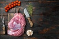 Fresh meat with herbs, oil and spices, on old dark  wooden table background, top view flat lay, with copy space for text Royalty Free Stock Photo