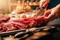 Fresh meat preparation and portioning.Whole uncut beef tenderloin.Raw meat seasoning. Cutting up filet mignon steaks. Spices and Royalty Free Stock Photo