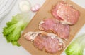 Fresh meat. Raw pork steak with spices on white background Royalty Free Stock Photo