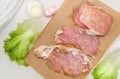 Fresh meat. Raw pork steak with spices on white background