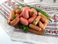 Fresh meat sausages on the board Royalty Free Stock Photo