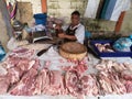 Fresh meat seller in Sanpatong buffalo market in Chiang Mai Thailand.