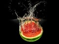 Fresh melon falling in water with splash on black background Royalty Free Stock Photo