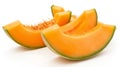 Fresh melon slices with vibrant orange flesh and green rind on a white background