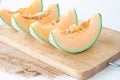 Fresh melons sliced on wooden cutting board. Healthy fruit. Royalty Free Stock Photo