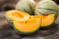 Fresh melons on wooden table Royalty Free Stock Photo