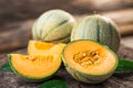 Fresh melons on wooden table Royalty Free Stock Photo