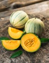 Fresh melons on wooden table