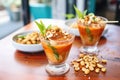 fresh micheladas with a bowl of spicy peanuts on the side Royalty Free Stock Photo