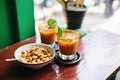 fresh micheladas with a bowl of spicy peanuts on the side Royalty Free Stock Photo