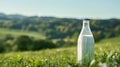 Fresh Milk Bottle in Scenic Green Countryside Landscape with Rolling Hills and Clear Sky