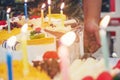 Fresh milk cakes and beautifully decorated fruits with birthday candles prepared to surprise