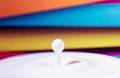 Fresh milk droplet isolated on interesting colourful background - dairy products - lactose intolerance