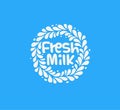 Fresh milk emblem. White milk drops splashed around the circle with text inside on blue background. Modern fun style