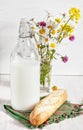 Fresh milk in old fashioned bottle with baguette Royalty Free Stock Photo