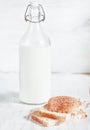 Fresh milk in old fashioned bottle and homemade bread Royalty Free Stock Photo
