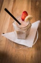 Fresh milk, strawberry and banana smoothie drink on wodeen table Royalty Free Stock Photo