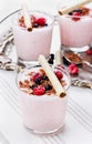 Fresh milkshake, yogurt, dessert, smoothie with strawberry decorated grated chocolate and frozen raspberries, blueberries